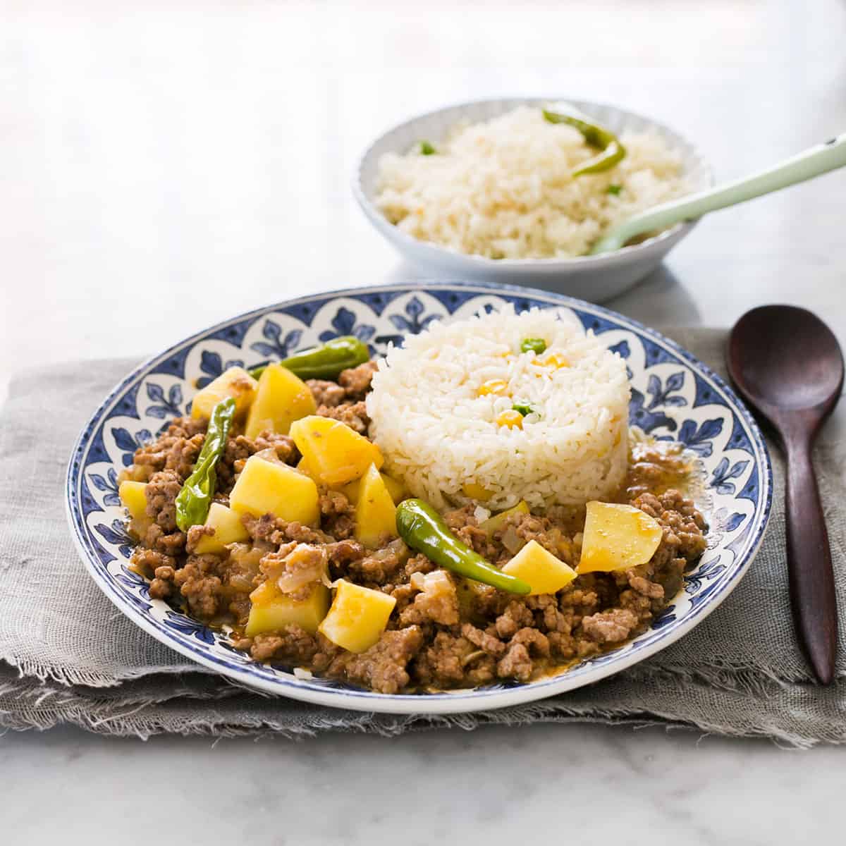 Mexican picadillo recipe with potatoes and white rice as a side dish.
