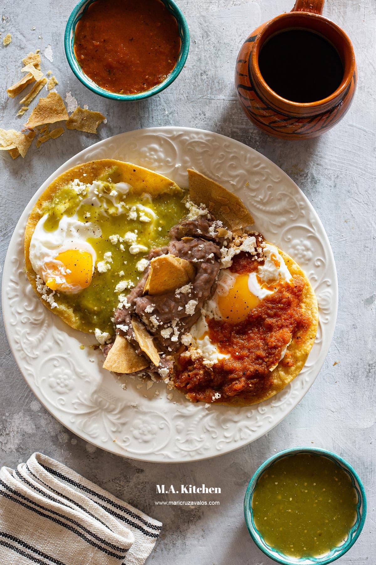 Huevos divorciados served in a plate and coffee on the side.