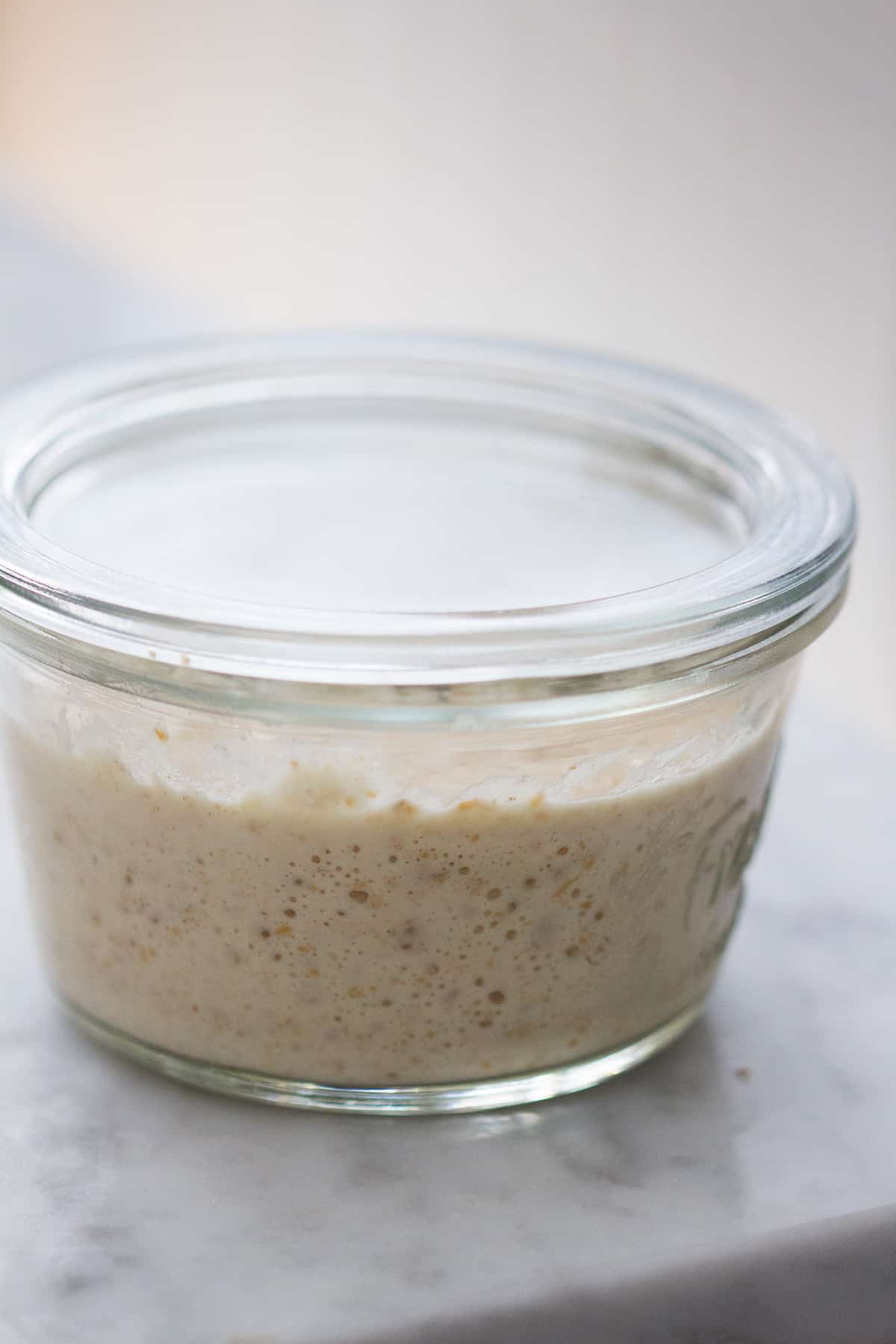 A jar of sourdough starter | scraping method