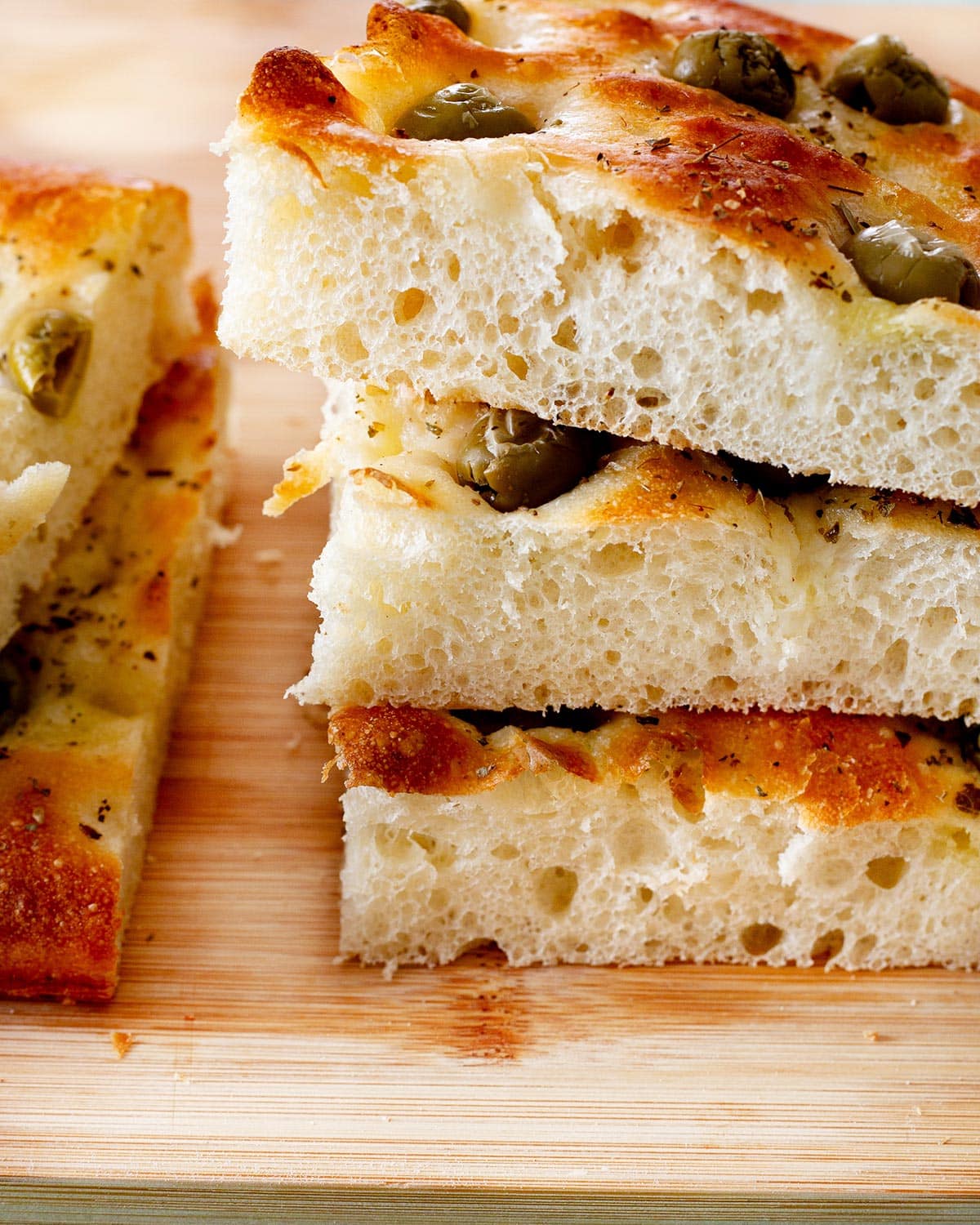 Close-up of focaccia con le olive to see its fluffiness.