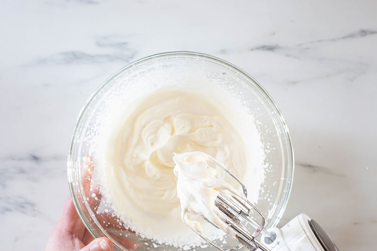 Whipped cream in a bowl for making straciatella gelato.
