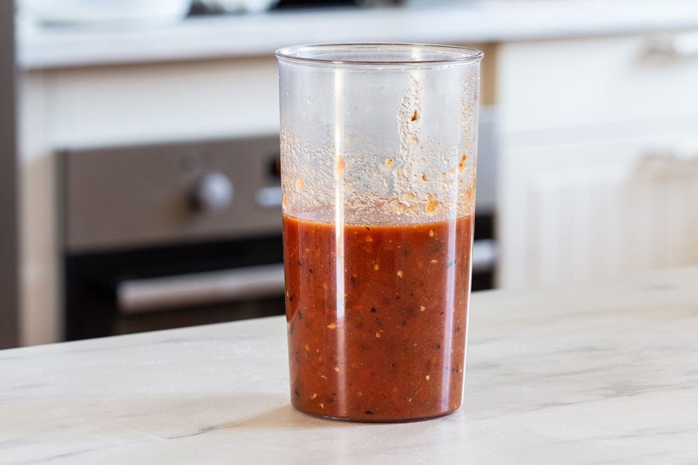 Tomato and chipotle salsa in a immersion blender.