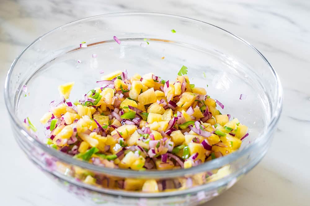 Pineapple jalapeno salsa in a glass bowl.