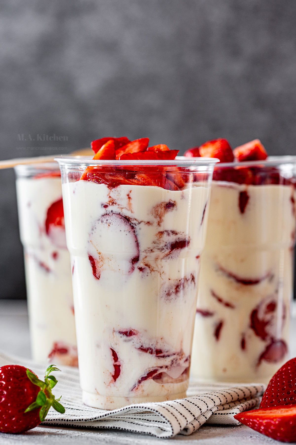 Mexican strawberries and cream Fresas Con Crema, served on cups.