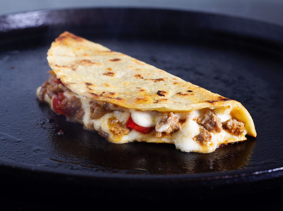 Taco quesadilla with melty cheese and juicy taco meat filling.