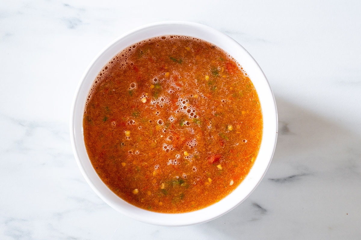 Chile sauce on a white bowl.