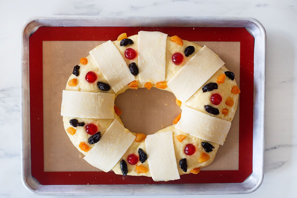 unbaked Rosca de Reyes with the decorations on.