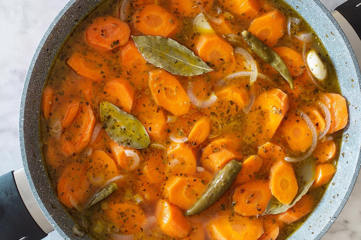 Close-up of Mexican pickled carrots in a pan.