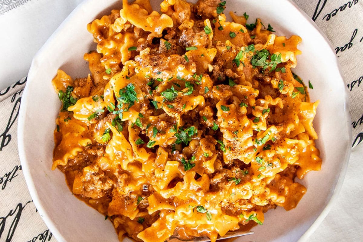 Overhead of cheesy taco pasta on a plate.