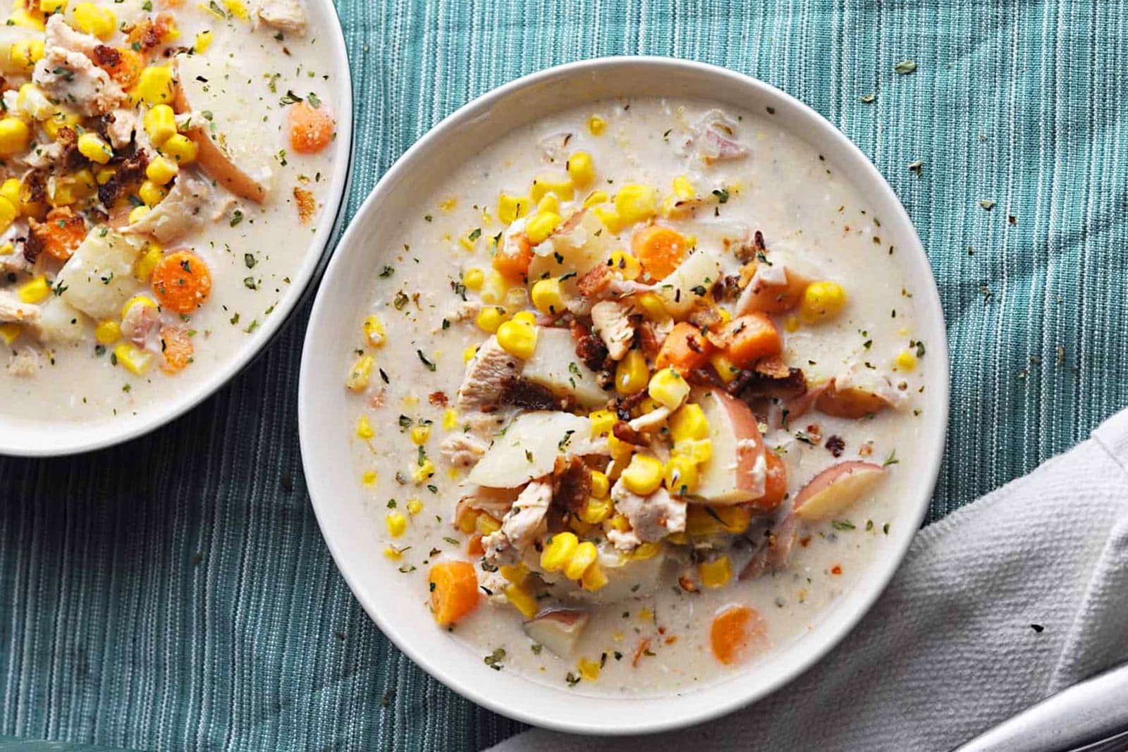 Bowl of slow cooked chicken and corn soup.