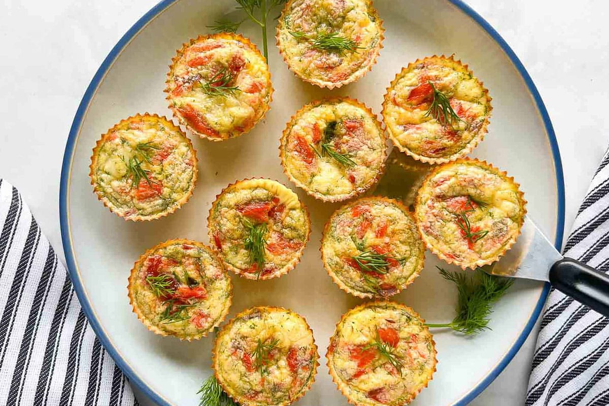 Crustless smoked salmon mini quiches on a plate.
