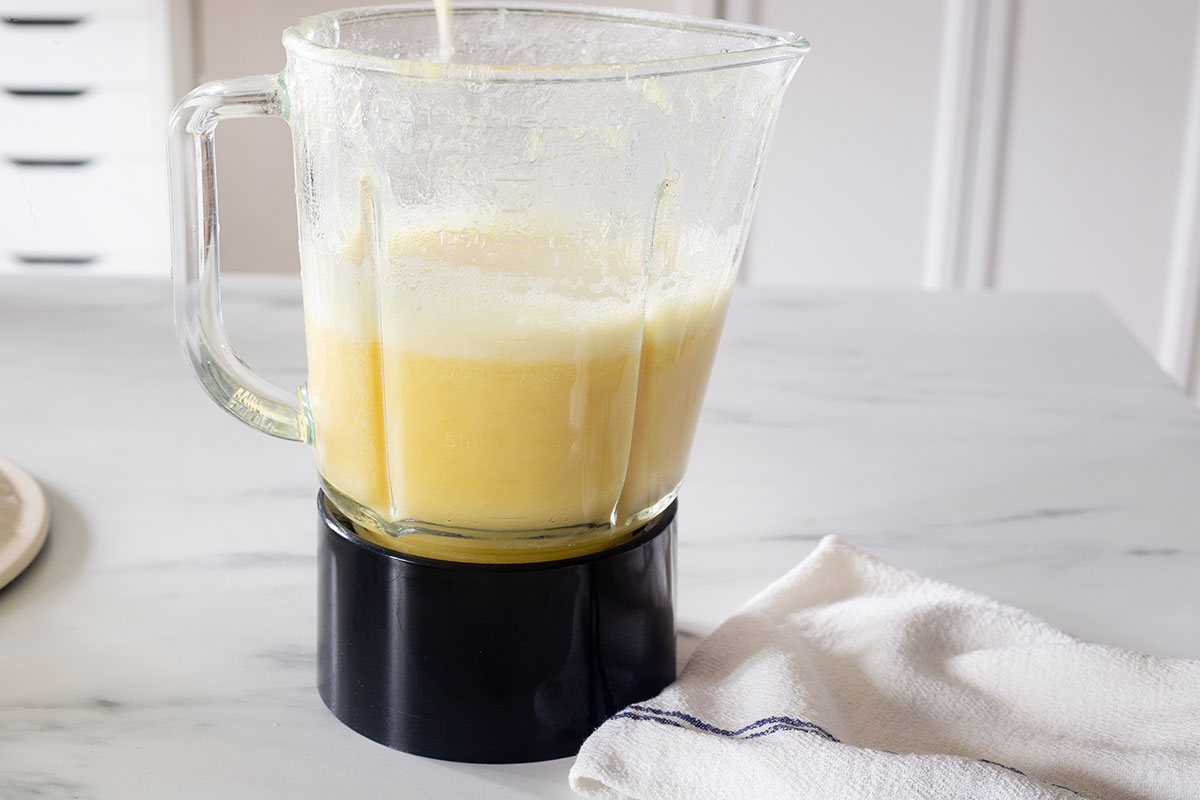 Pineapple mixture in a blender.