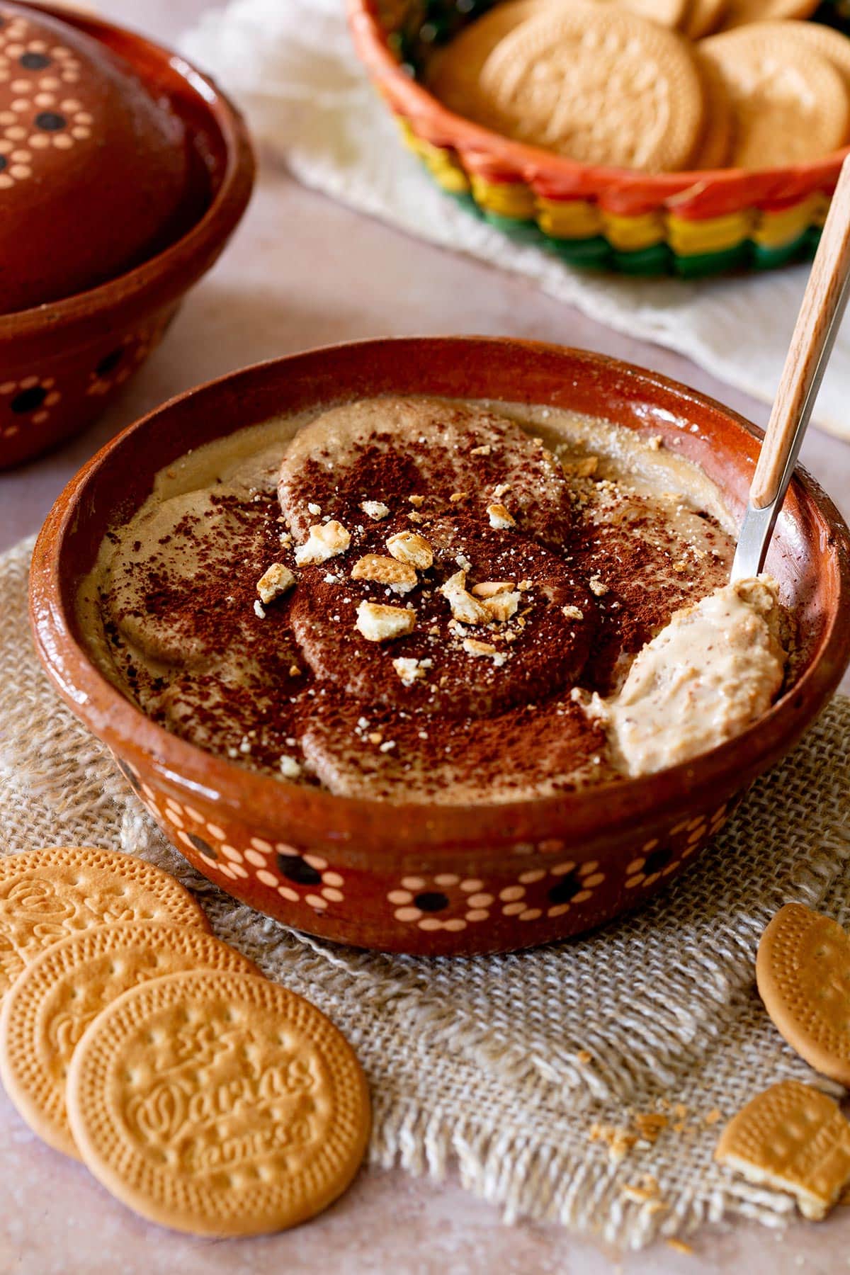 Carlota de Café in a terracota bowl with a spoon.