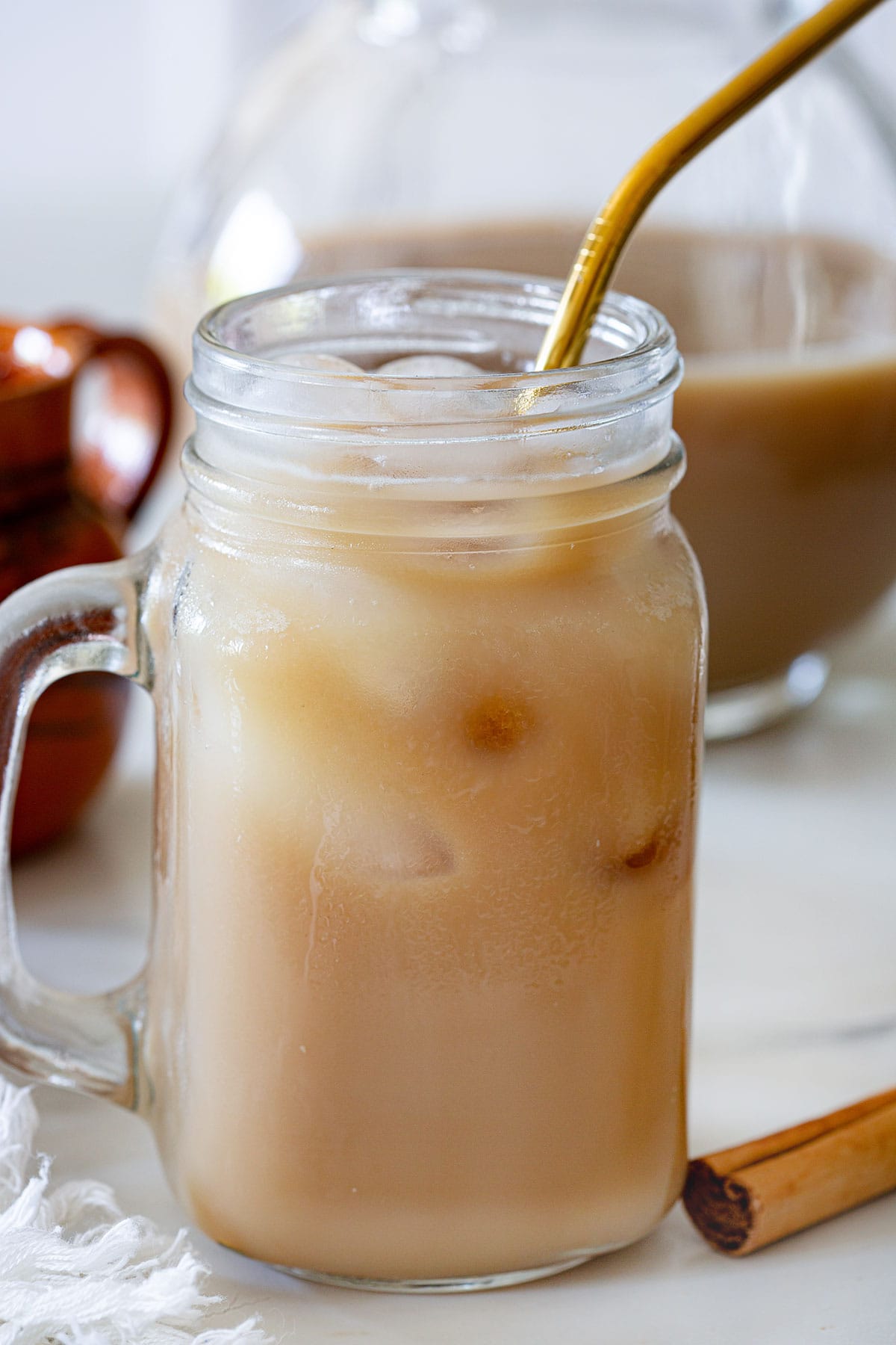 Mexican agua de café in a large cup with a straw.