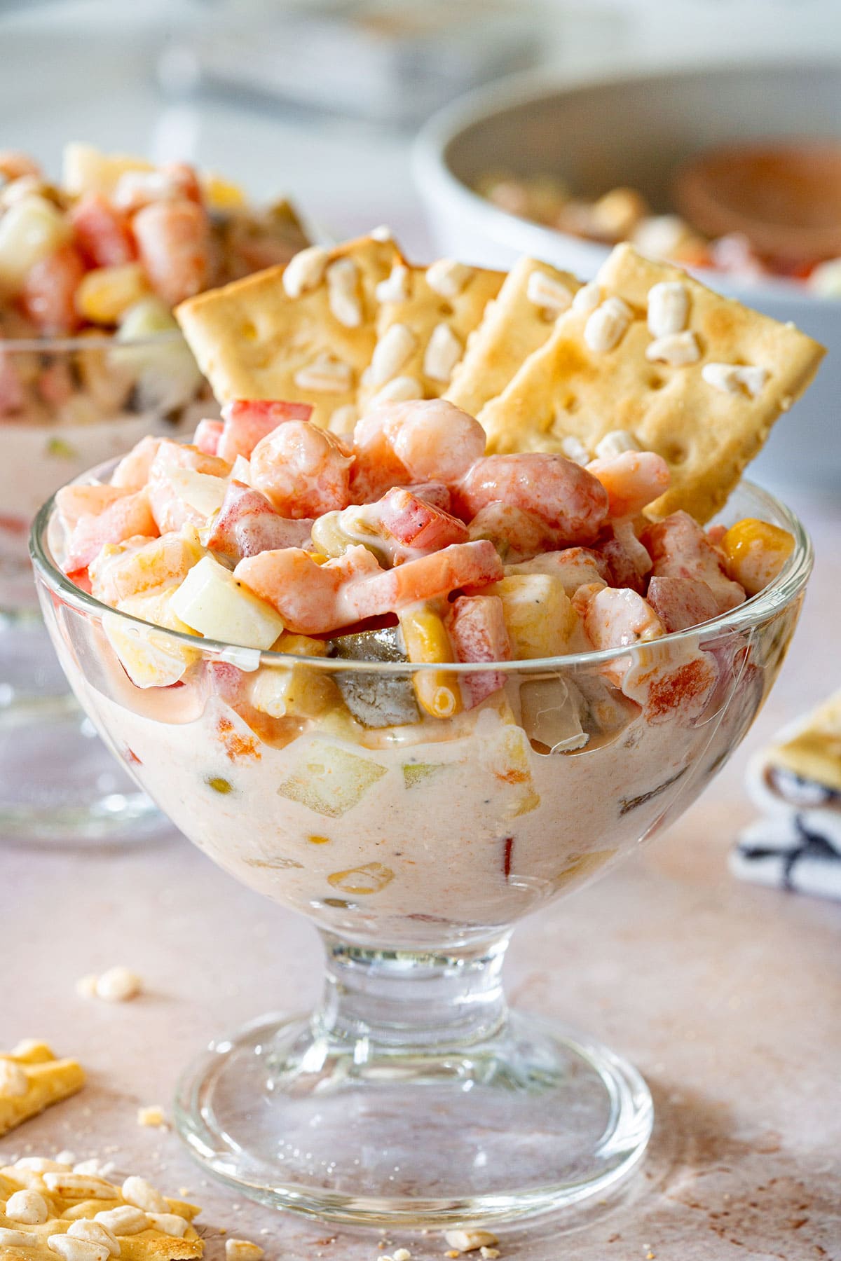 Ensalada de Camaron in a cup with saltine crackers.