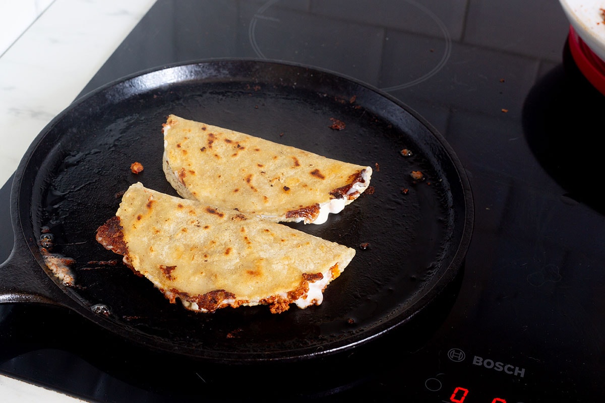 Crispy chorizo quesadillas, or quesadillas de chorizo on a griddle.