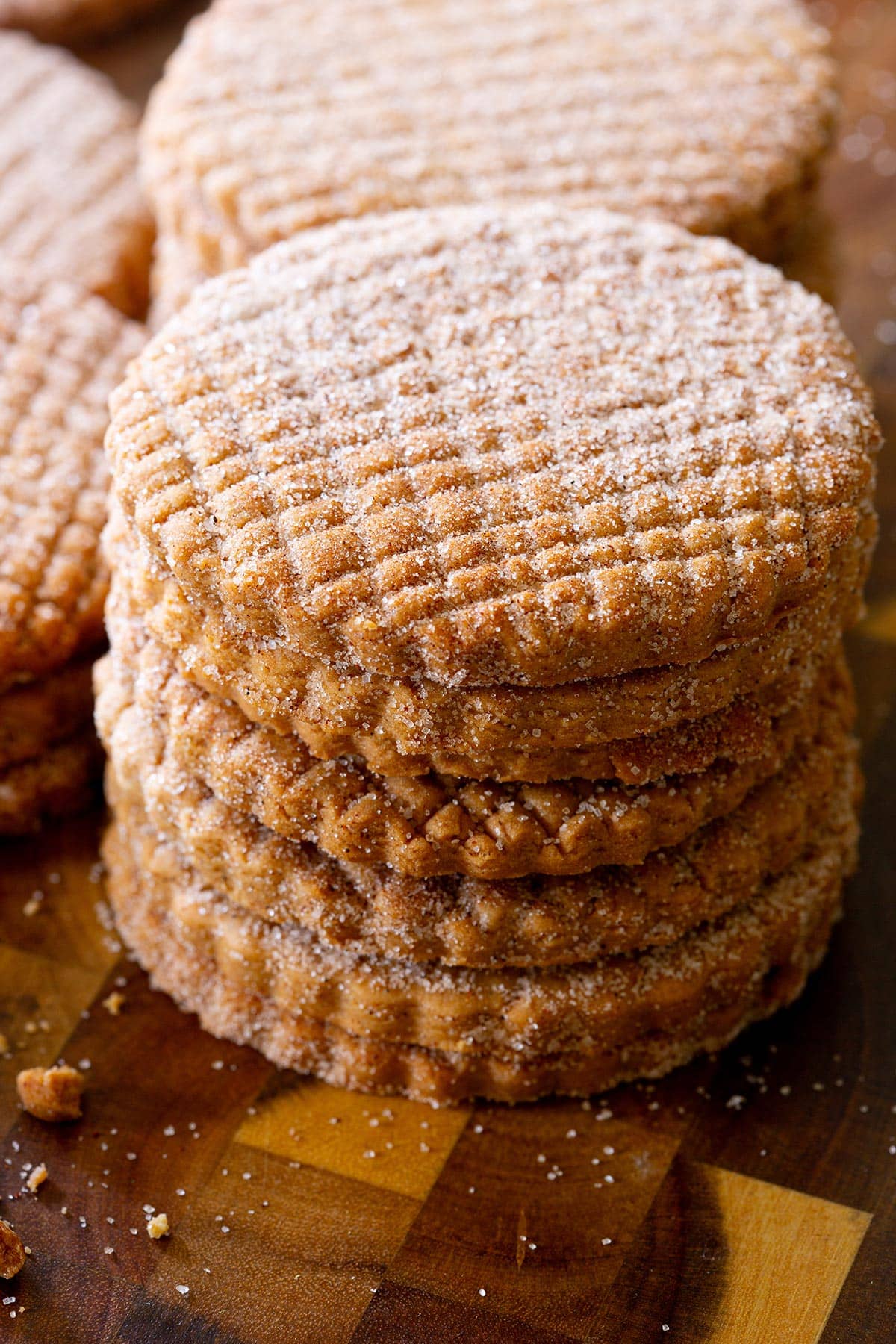 Mexican Canelitas or Galletas de Canela, cinnamon flavored cookies, piled on a table.