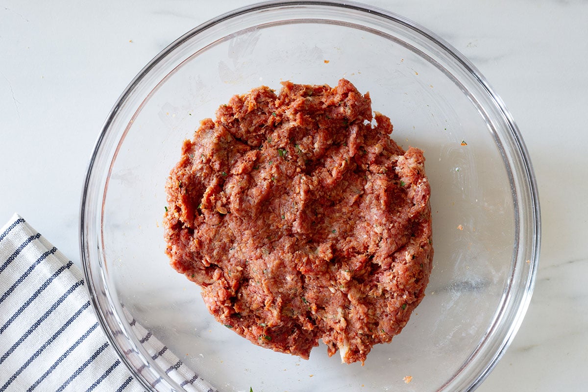 Ground meat mixture combined with bread, spices, and seasonings for pacholas.